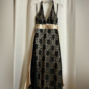 Black Lace backless dress.  size 6 Gold underlay. Like New.  Knee Length